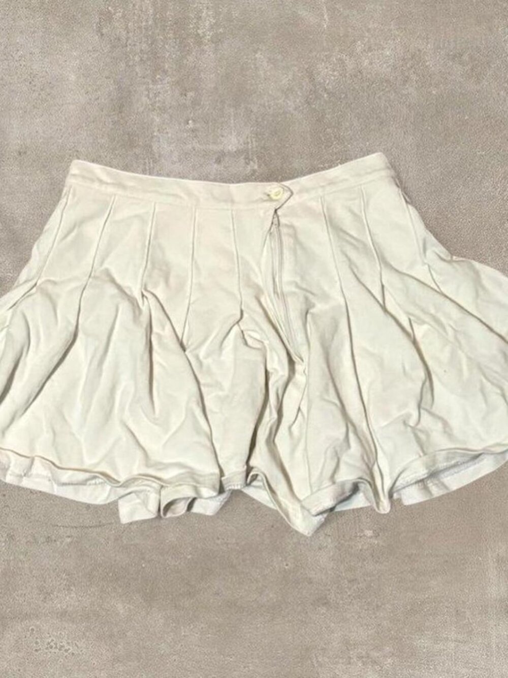Urban Outfitters white pleated mini skirt with button latch detail (size S)